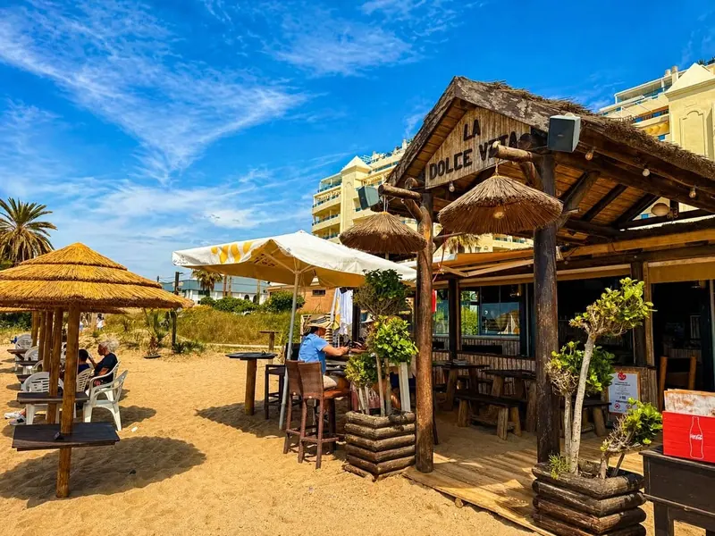 Thatched parasols and terrace in front of the chiringuito