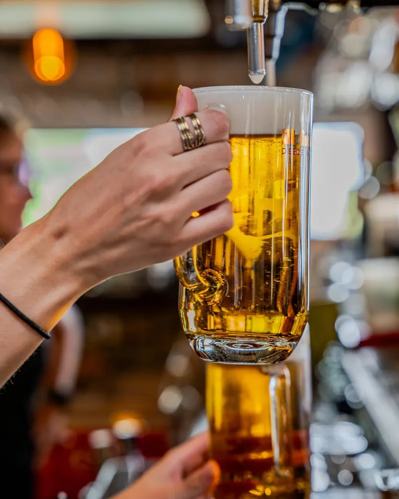 A beer being poured at the tap